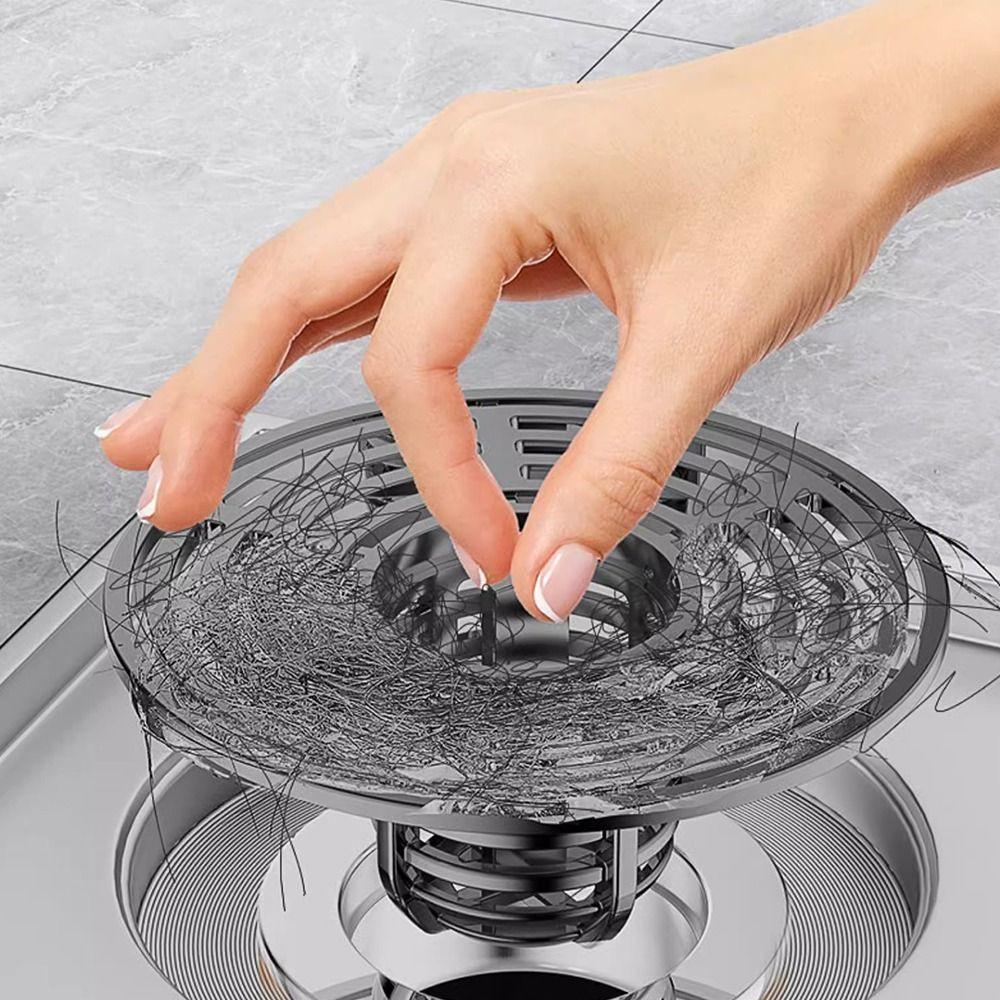 un siphon de sol anti-odeurs / grille de drainage inox avec filtre