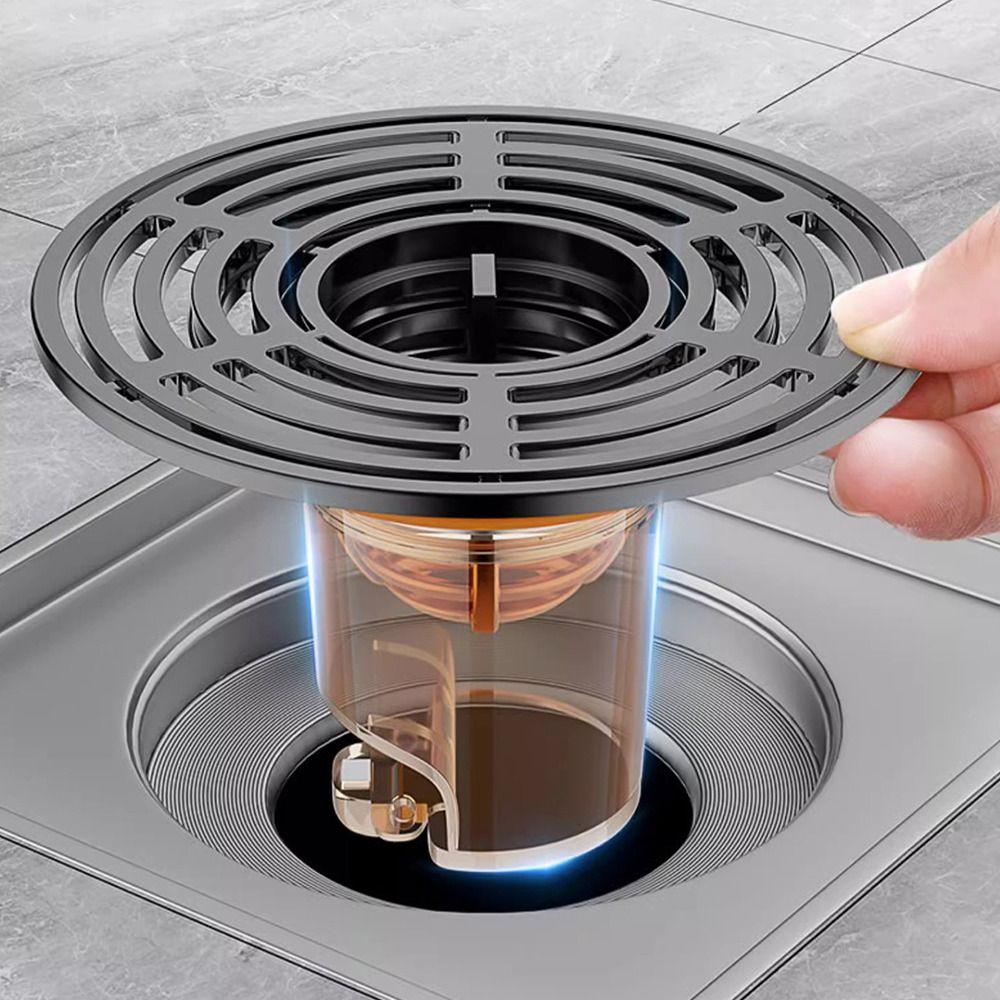 un siphon de sol anti-odeurs / grille de drainage inox avec filtre